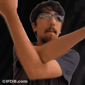 Man With Glasses And Beard Holding Arm Up GIF