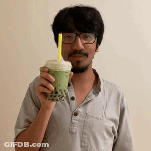 Man With Glasses And Beard Holding Green Tea GIF