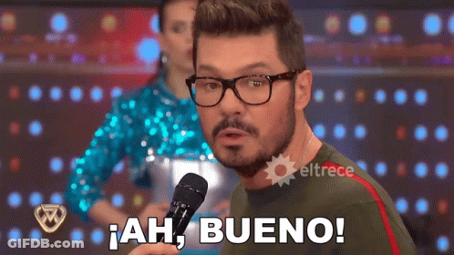 Man With Glasses And Beard Holding Microphone Saying Ah Bueno GIF