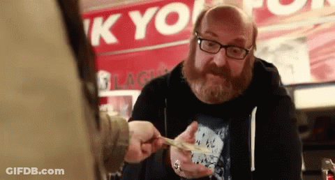 Man With Glasses And Beard Holding Money In Front Of K Yo Sign GIF