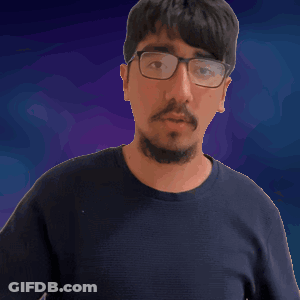 Man With Glasses And Beard Holding Paper GIF