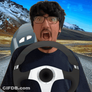 Man With Glasses And Beard Holding Steering Wheel In Mouth GIF