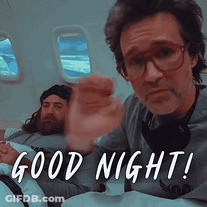 Man With Glasses And Beard In Bed Saying Good Night GIF