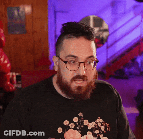 Man With Glasses And Beard In Black Floral Shirt GIF