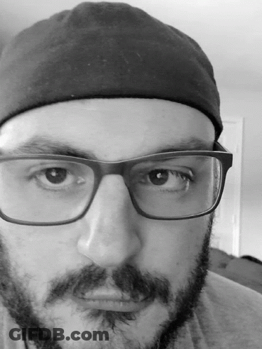 Man With Glasses And Beard In Black Hat GIF