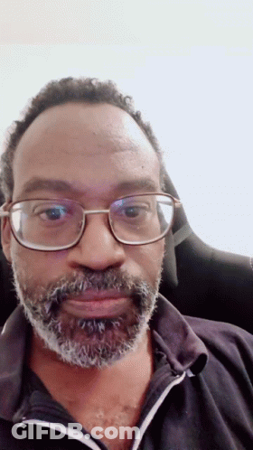 Man With Glasses And Beard In Black Shirt GIF