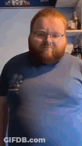Man With Glasses And Beard In Blue Shirt GIF