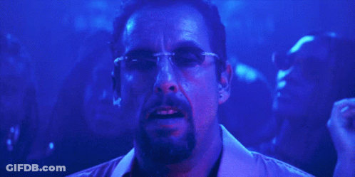 Man With Glasses And Beard In Front Of Crowd GIF