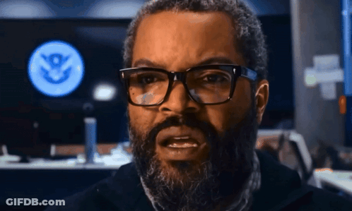 Man With Glasses And Beard In Front Of Screen With S GIF