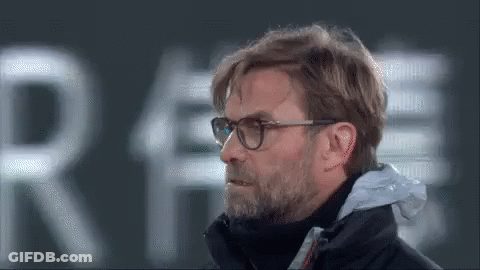 Man With Glasses And Beard In Front Of Sign Saying Re GIF