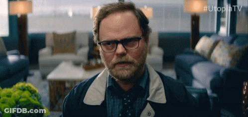 Man With Glasses And Beard In Living Room Utopiatv GIF