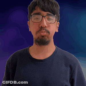 Man With Glasses And Beard Looking At Camera GIF