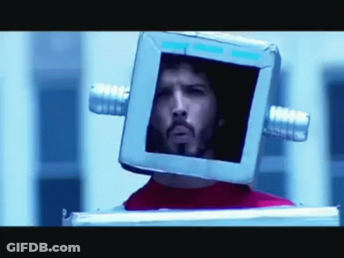 Man With Glasses And Beard Looking At Reflection GIF