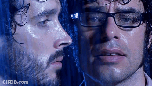 Man With Glasses And Beard Looking At Reflection GIF