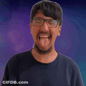 Man With Glasses And Beard Looks At Camera GIF