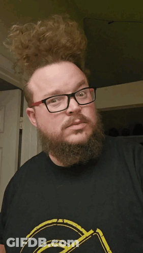 Man With Glasses And Beard Looks Surprised GIF