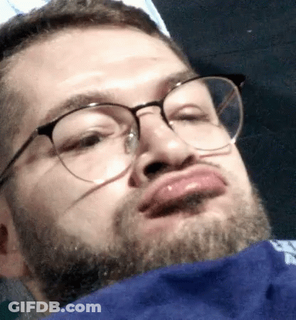 Man With Glasses And Beard Making Face GIF
