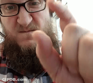 Man With Glasses And Beard Making Funny Face GIF