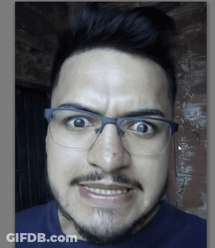 Man With Glasses And Beard Making Funny Face GIF