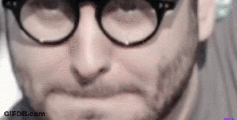 Man With Glasses And Beard Making Funny Face GIF