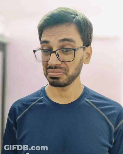 Man With Glasses And Beard Making Funny Face GIF