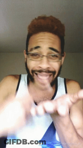 Man With Glasses And Beard Making Heart Hands GIF