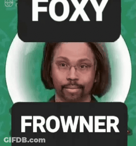 Man With Glasses And Beard Next To Foxy Frowner Sign GIF