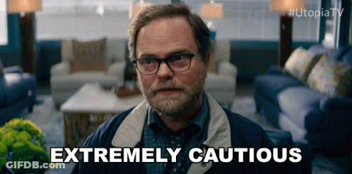 Man With Glasses And Beard Saying Extremely Cautious GIF
