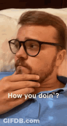 Man With Glasses And Beard Saying How You Doin GIF