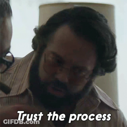 Man With Glasses And Beard Saying Trust The Process GIF
