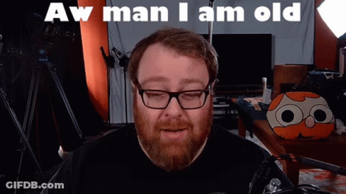 Man With Glasses And Beard Says Aw Man I Am Old GIF