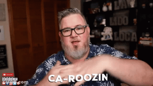 Man With Glasses And Beard Says Carousin GIF