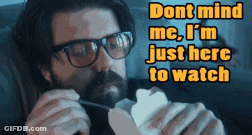 Man With Glasses And Beard Says Don't Mind Me I'm Just Here To Watch GIF