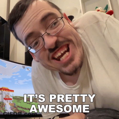 Man With Glasses And Beard Says It's Pretty Awesome In Front Of Computer Monitor GIF