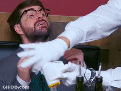 Man With Glasses And Beard Served By Waiter In White Gloves GIF