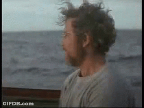 Man With Glasses And Beard Sitting On Boat GIF