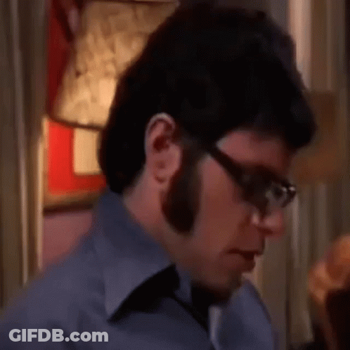 Man With Glasses And Beard Sitting GIF