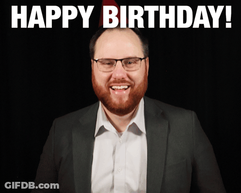 Man With Glasses And Beard Smiling Happy Birthday Sign GIF