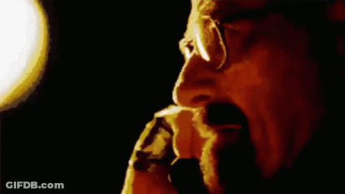 Man With Glasses And Beard Smoking Cigarette GIF