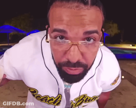 Man With Glasses And Beard Wearing Beach Boys Shirt GIF