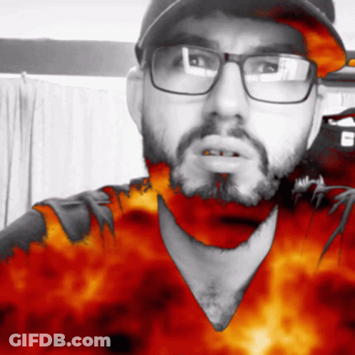 Man With Glasses And Beard Wearing Flame Hat GIF