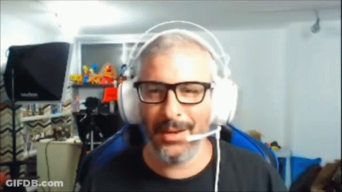 Man With Glasses And Beard Wearing Headphones And Microphone GIF