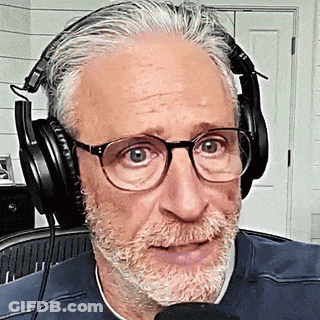 Man With Glasses And Beard Wearing Headphones Talking Into Microphone GIF