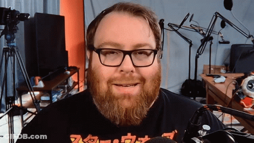 Man With Glasses And Beard Wearing Nintendo Shirt GIF