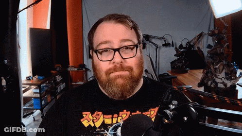 Man With Glasses And Beard Wearing Screw Shirt GIF