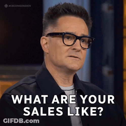 Man With Glasses And Black Jacket Saying What Are Your Sales Like GIF