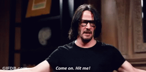 Man With Glasses And Black Shirt Says Come On Hit Me GIF