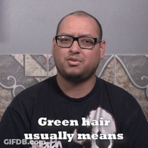Man With Glasses And Black Shirt Says Green Hair Usually Means GIF