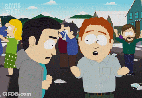 Man With Glasses And Blue Jacket Sitting On Park Bench GIF