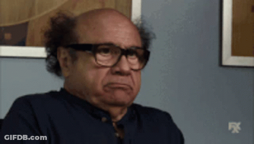 Man With Glasses And Blue Shirt In Front Of FX Wall GIF